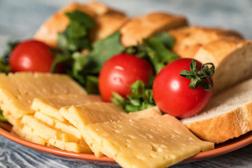 Swiss cheese with bread and vegetables