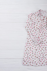 Fashionable nightie for little girl. Fine flower pattern over lightweight cotton fabric. Good gift for little daughter.