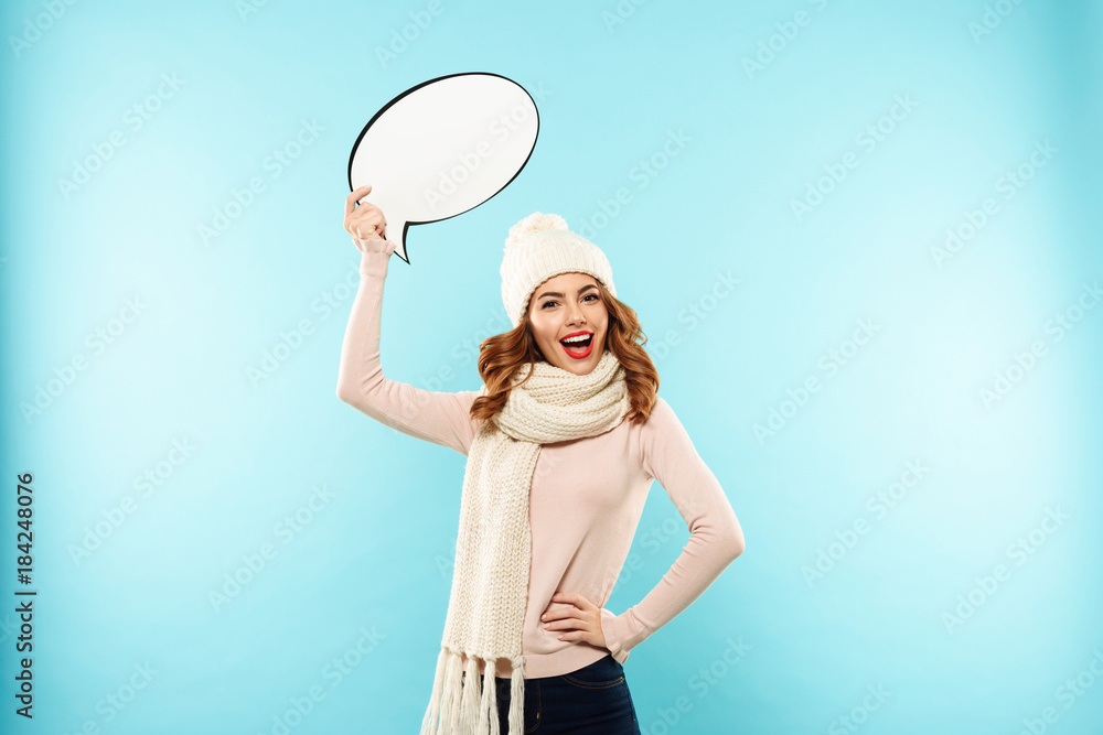 Poster portrait of a cheerful pretty girl dressed in winter clothes