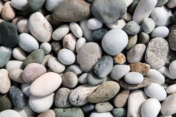 Fototapeta na wymiar Beach stones background. Top view.