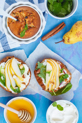 Sandwiches with cottage cheese, honey, pear, nuts and chocolate cupcakes with mint tea.