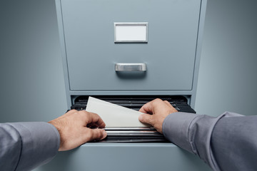 Office clerk searching for files