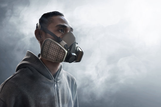 Graffiti artist wearing a gas mask