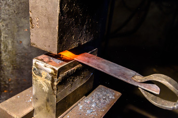 Forging molten metal. Making knives.