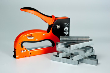 Stapler household, new, orange, reliable with staples