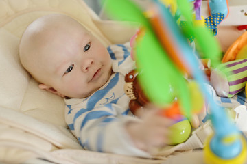 baby  in bouncer chair