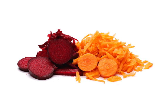 Fresh carrot and beetroot slices and shavings isolated on white background