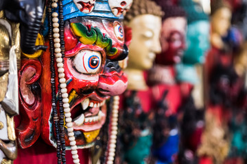 Fototapeta premium Traditional red Bhairav hindu mask hanging at souvenir market