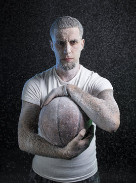 Studio portrait of sportsmen using balls