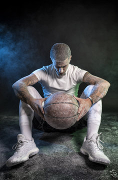 Studio portrait of sportsmen using balls