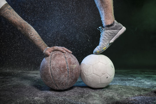 Studio portrait of sportsmen using balls