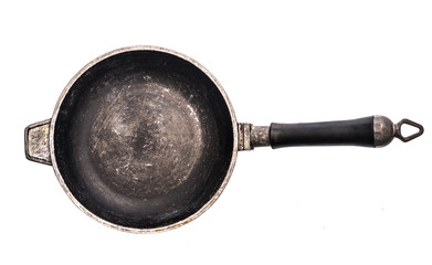 Old empty cast iron frying pan isolated on white background