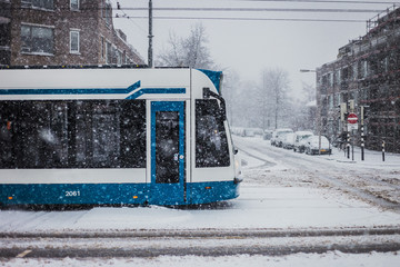 Tram in Amsterdam on snowy day