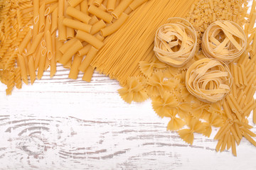 Italian pasta types on wooden table
