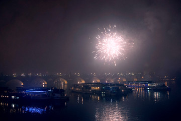 Fireworks on New Year's Eve over ships on the Vltava River in Prague