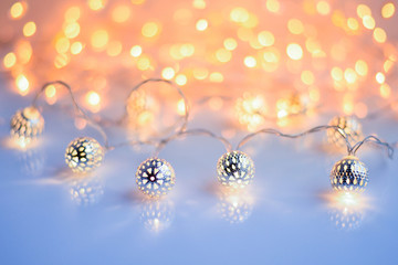 Christmas lights on glossy background. Christmas festive background