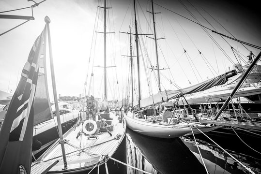 Beautiful marina view, sailboats and motorboats in port. Photo in black and white