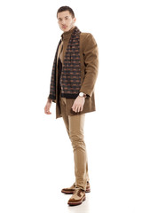 young handsome man in winter clothes with a scarf