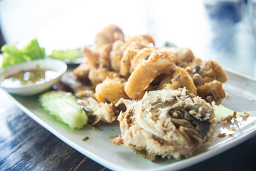 Fried Giant gourami fish  with garlic and seafood sauce, Uthai Thani province, Thailand