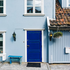 Blue door on blue house