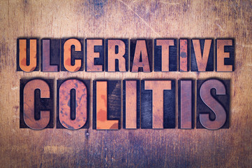 Ulcerative Colitis Theme Letterpress Word on Wood Background