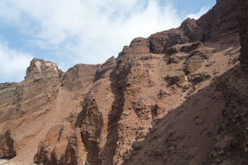 The red mountains on the beach of Santorini.