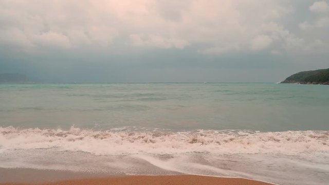 Sea with broken water  and the coastline, Budva, Montenegro, Adriatic, Mediterranean.  Autumn time. Slow motion
