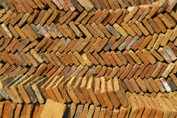 a pile of Bricks lie at an angle in diagonal lines