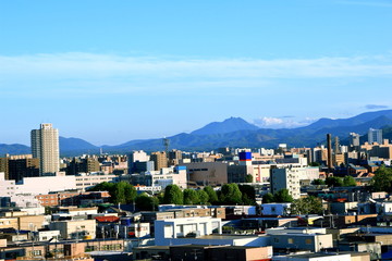 View of mountain ranges from the city of Sapporo