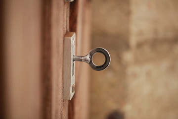 key in the lock of the wooden door