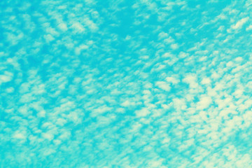 Fototapeta na wymiar blue sky and clouds cross process filter effect