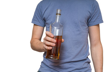Alcoholic man is holding bottle with whiskey. Isolated on white background.