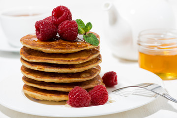 stack of pancakes with raspberries for breakfast