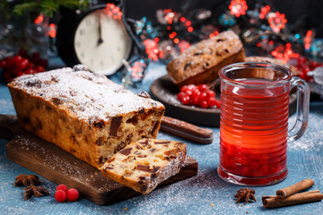 Traditional Christmas cake with fruits and nuts in festive decoration