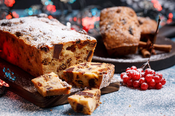 Traditional Christmas cake with fruits and nuts in festive decoration