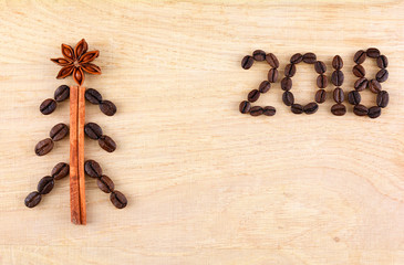 Background with coffee. Top view of coffee beans background. Christmas background with coffee. New Year Background of coffee beans. 2018 year.