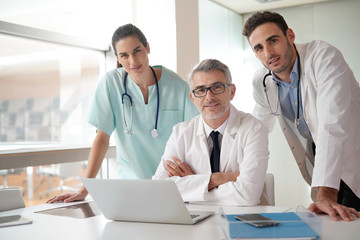 Portrait of medical people standing in hospital room
