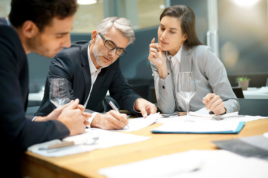 Executive People Doing Business Report Presentation In Restaurant