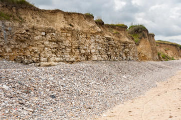 Rocks and gravel on Omaha Beach Normandy France