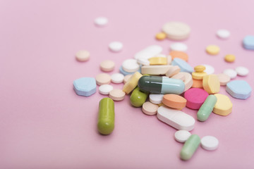 colorful medicine. Pharmacy on pink background.