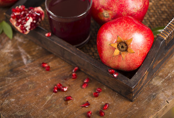 pomegranate juice on a wooden background