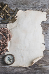 vintage card with compass and others measurement instruments on the wooden timber