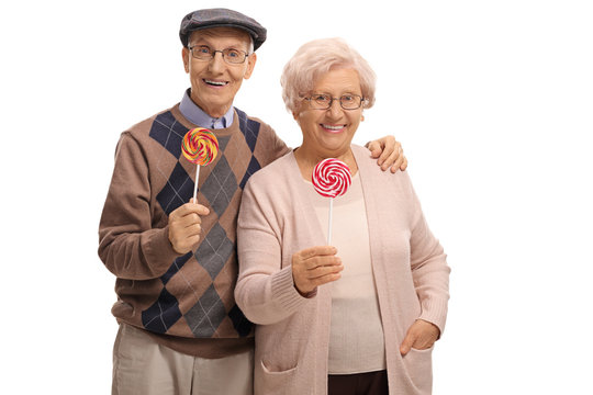 Senior couple with lollipops