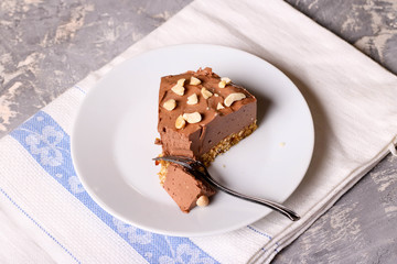 Cold chocolate cheesecake on a white plate