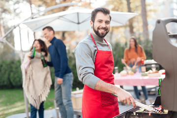 A man is cooking barbecue food.