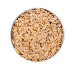 pounded unripe rice in bowl on white background