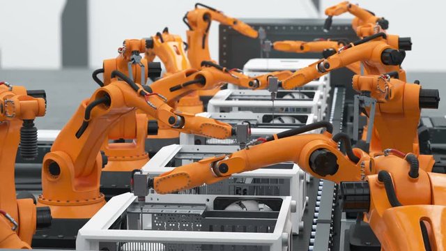 A Lot of Robotic Arms Assembling Computers On Conveyor Belt. Modern Advanced Automated Process. Looped 3d Animation. Business and Technology Concept. 4k Ultra HD 3840x2160.