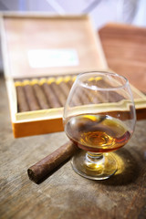 Large box of Cuban cigars on a wooden table