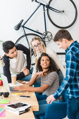african american girl pointing on caucasian boy