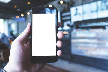 Hand on smartphone Blank Screen on Blur background